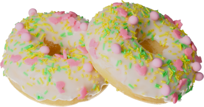 Leckerer Donut mit schönen grünen, rosa und gelben Streudekoren mit Hasenthema. 